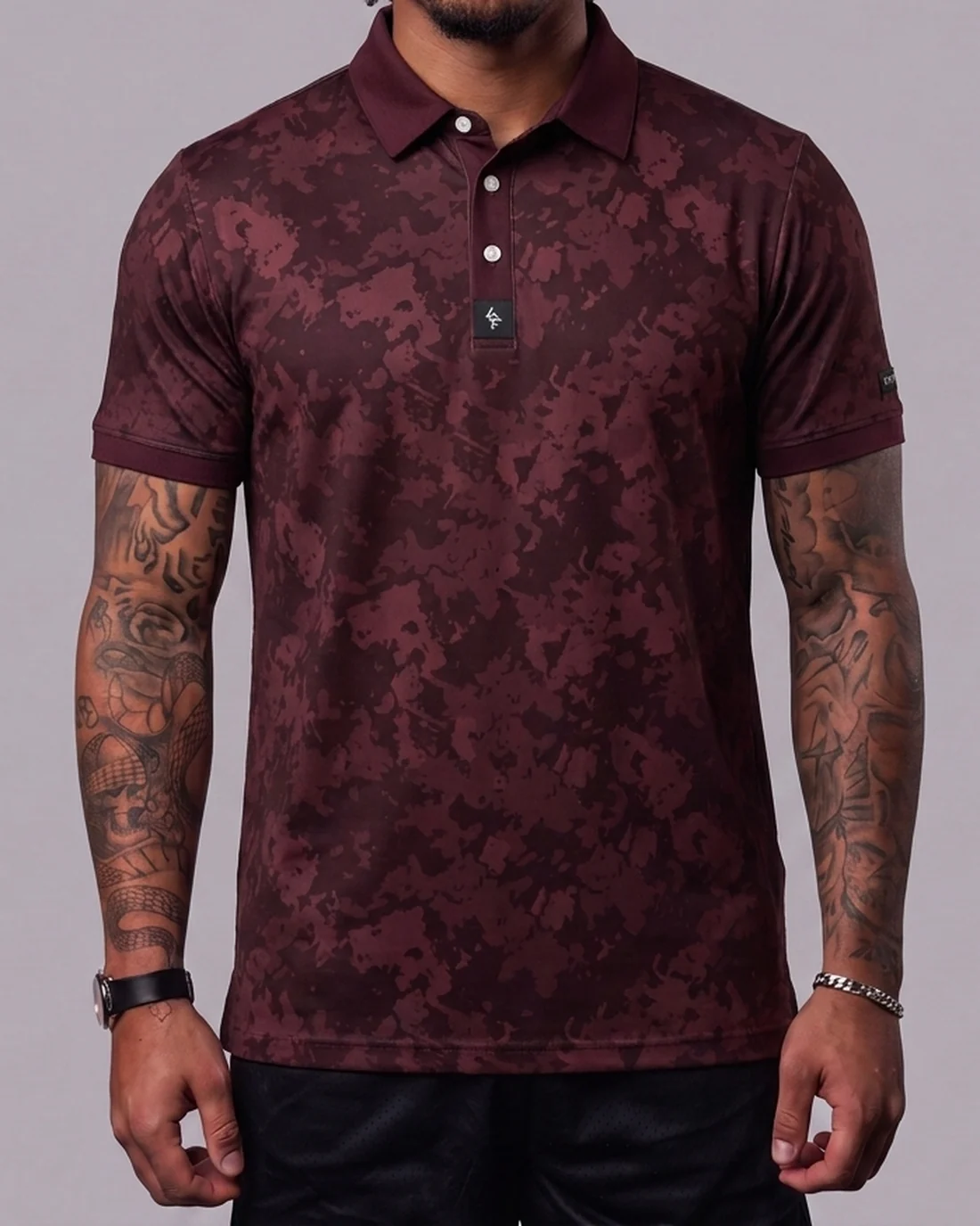 Model wearing the Byrd Gang Obsidian - Maroon men’s polo
