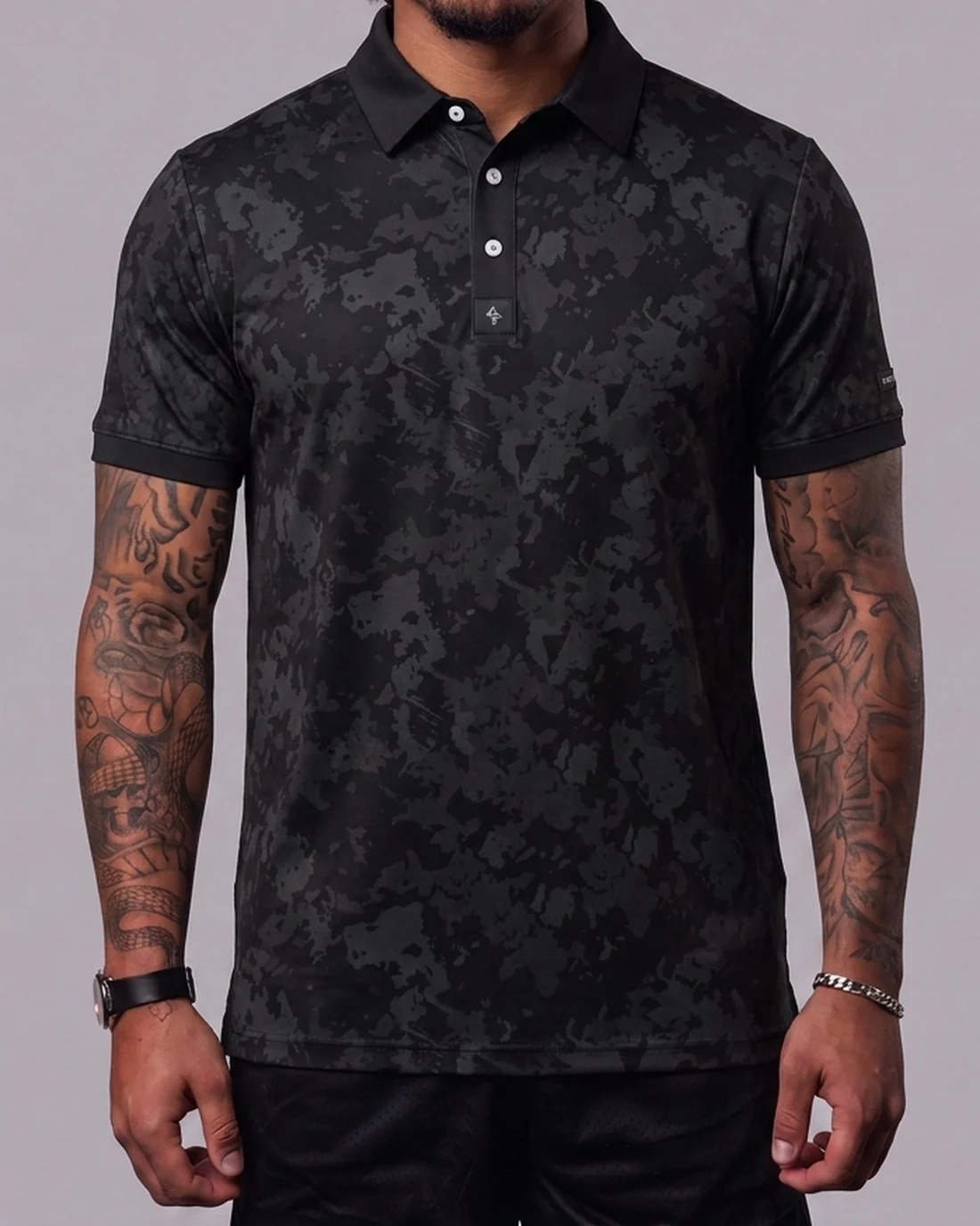 Model wearing the Byrd Gang Obsidian - Black men’s polo